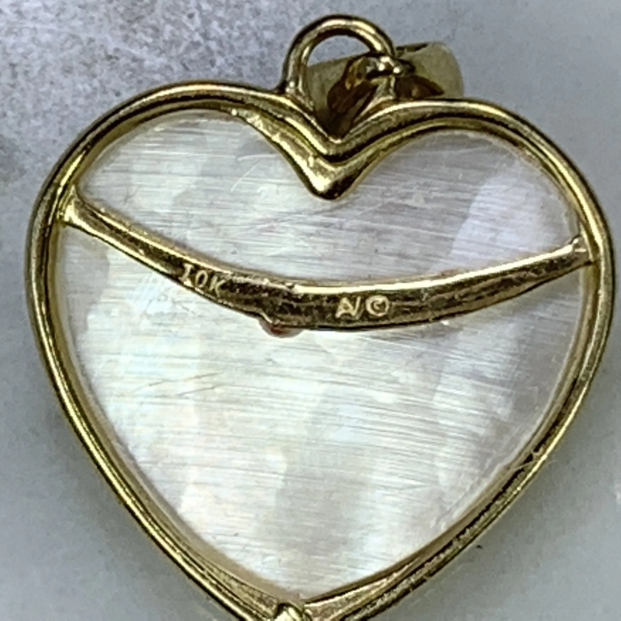 1960s Heart Shaped Mother of Pearl Pendant with Diamond and Ruby Flowers set in 10k Yellow Gold.