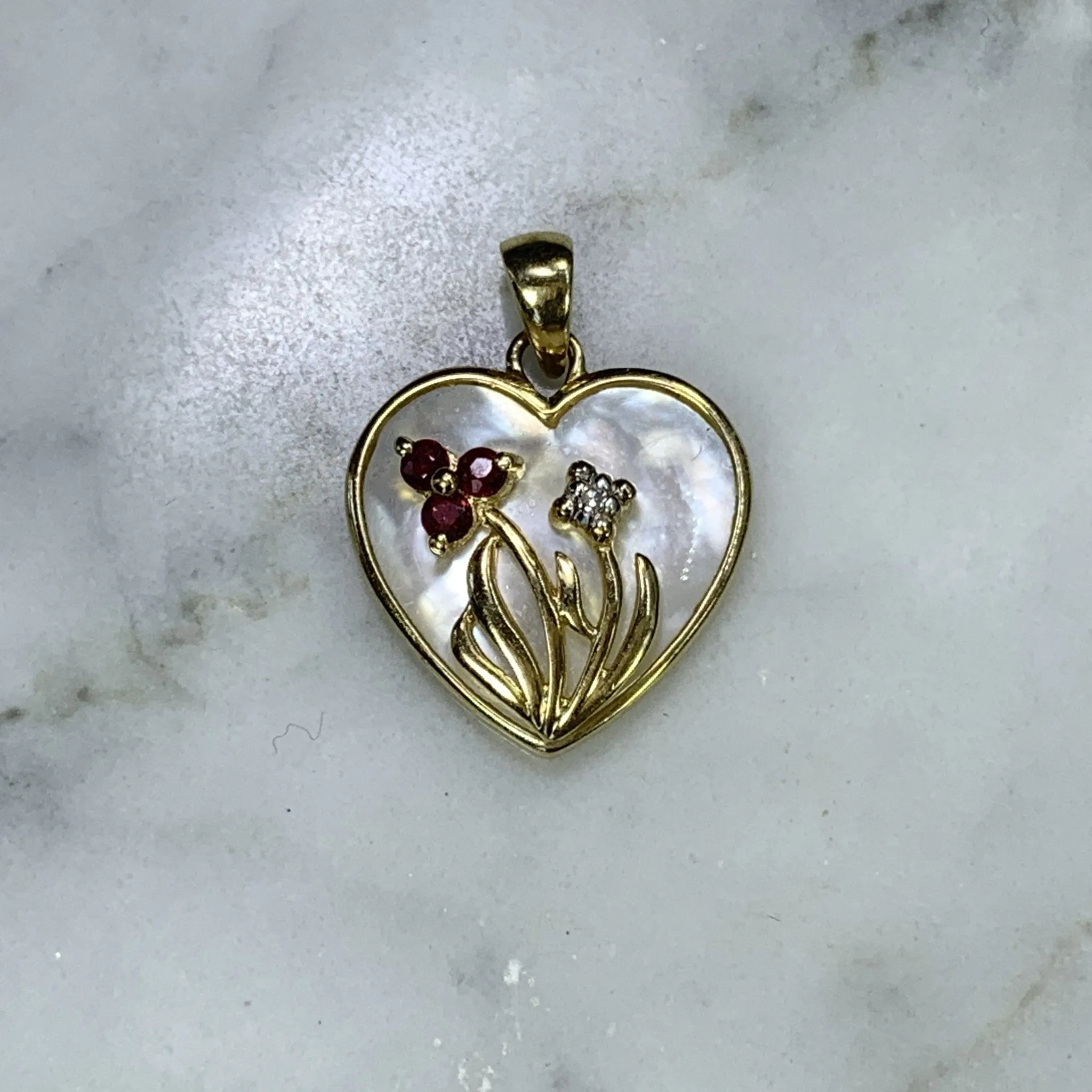 1960s Heart Shaped Mother of Pearl Pendant with Diamond and Ruby Flowers set in 10k Yellow Gold.