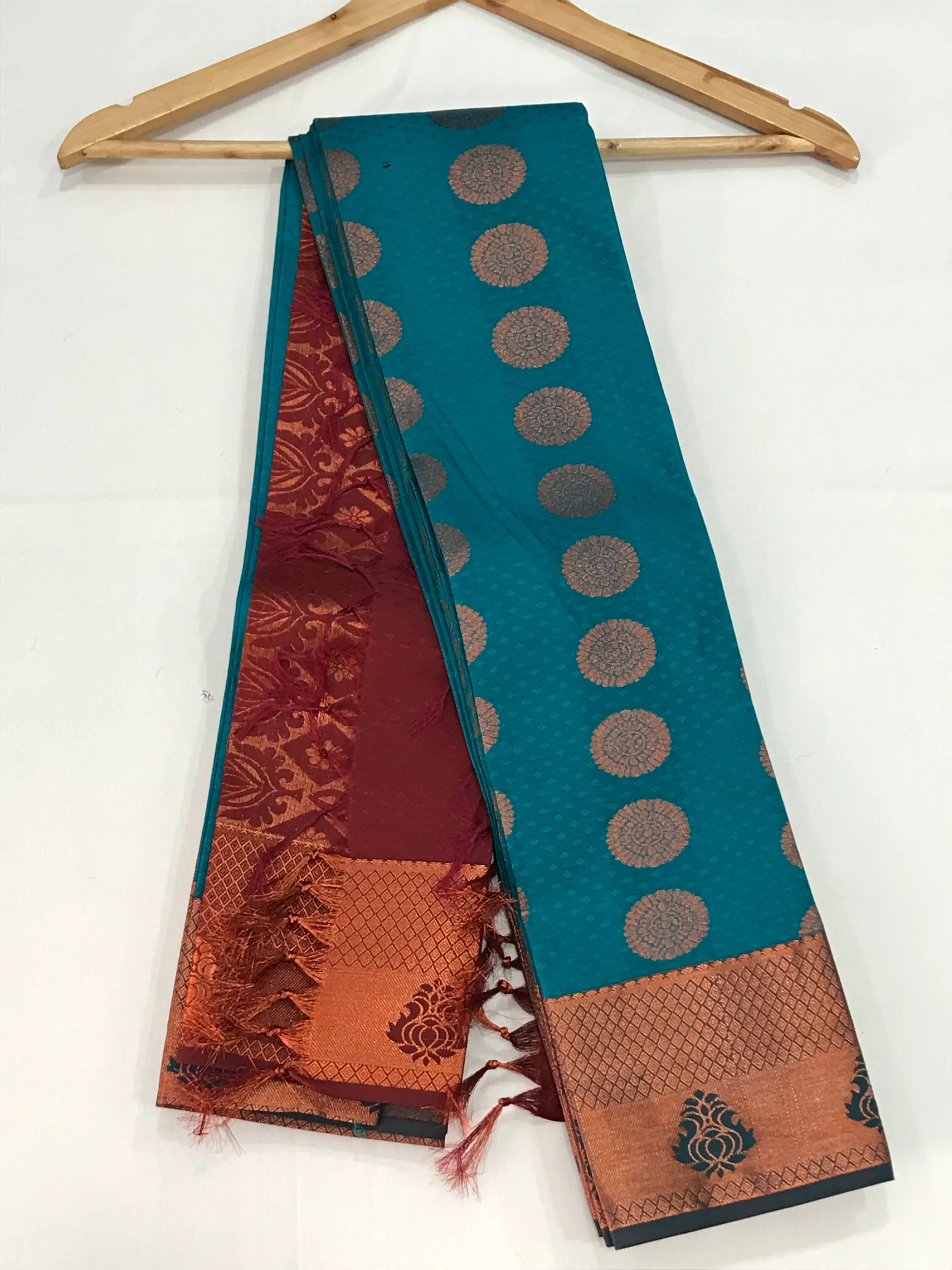 Beautiful Blue Color Emboss Butta Motifs All Over Body And Copper Zari Border