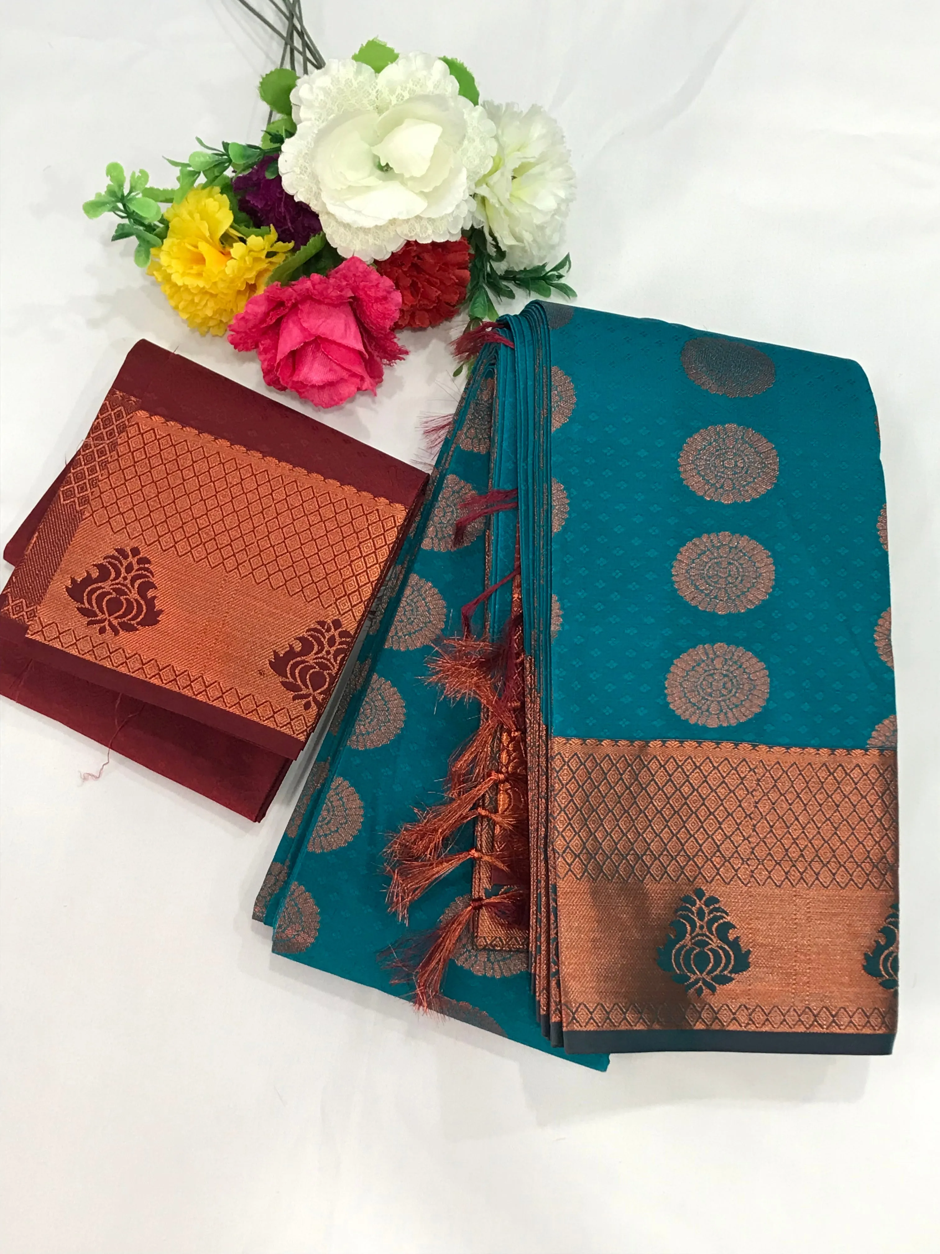 Beautiful Blue Color Emboss Butta Motifs All Over Body And Copper Zari Border