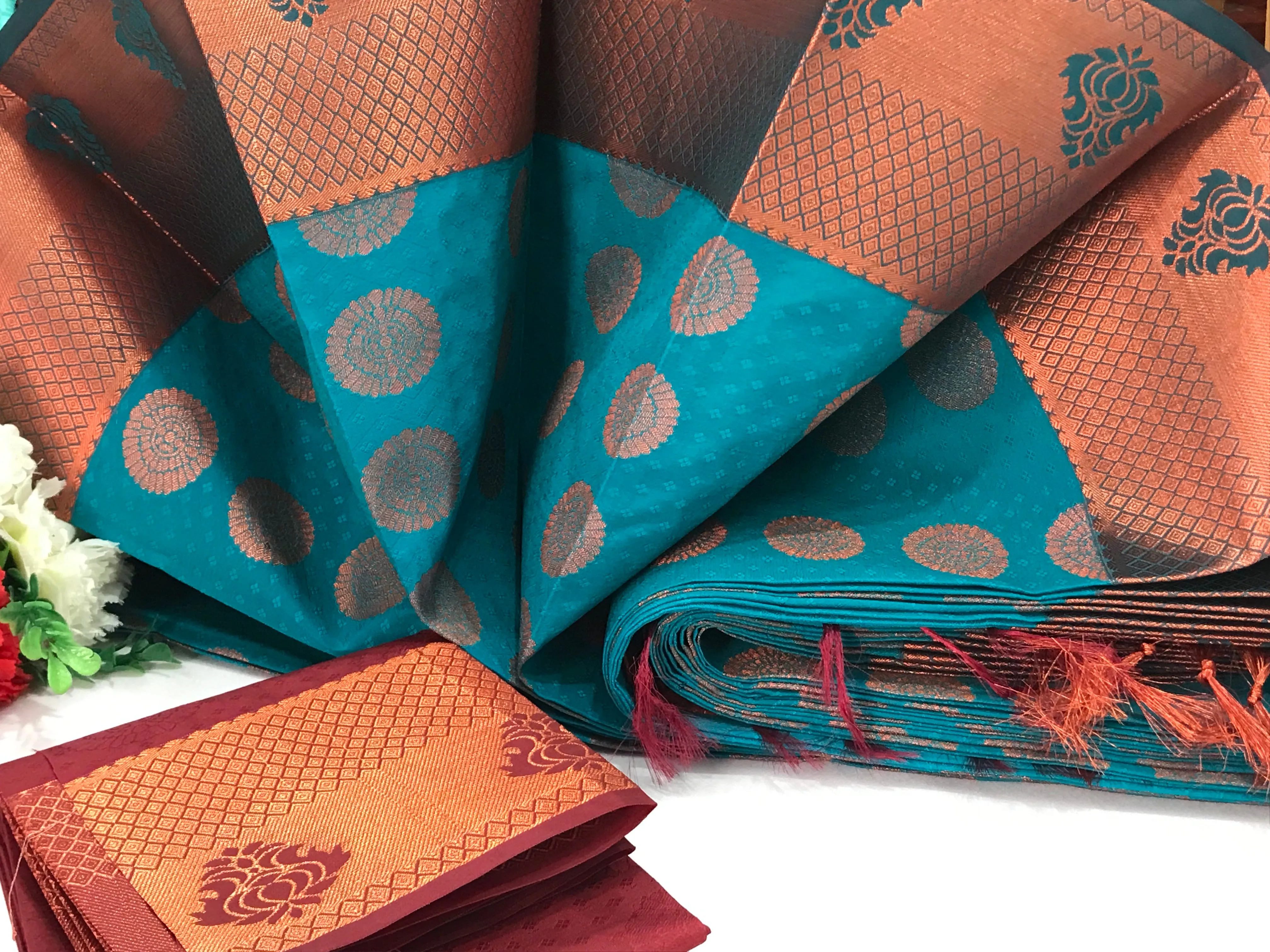 Beautiful Blue Color Emboss Butta Motifs All Over Body And Copper Zari Border