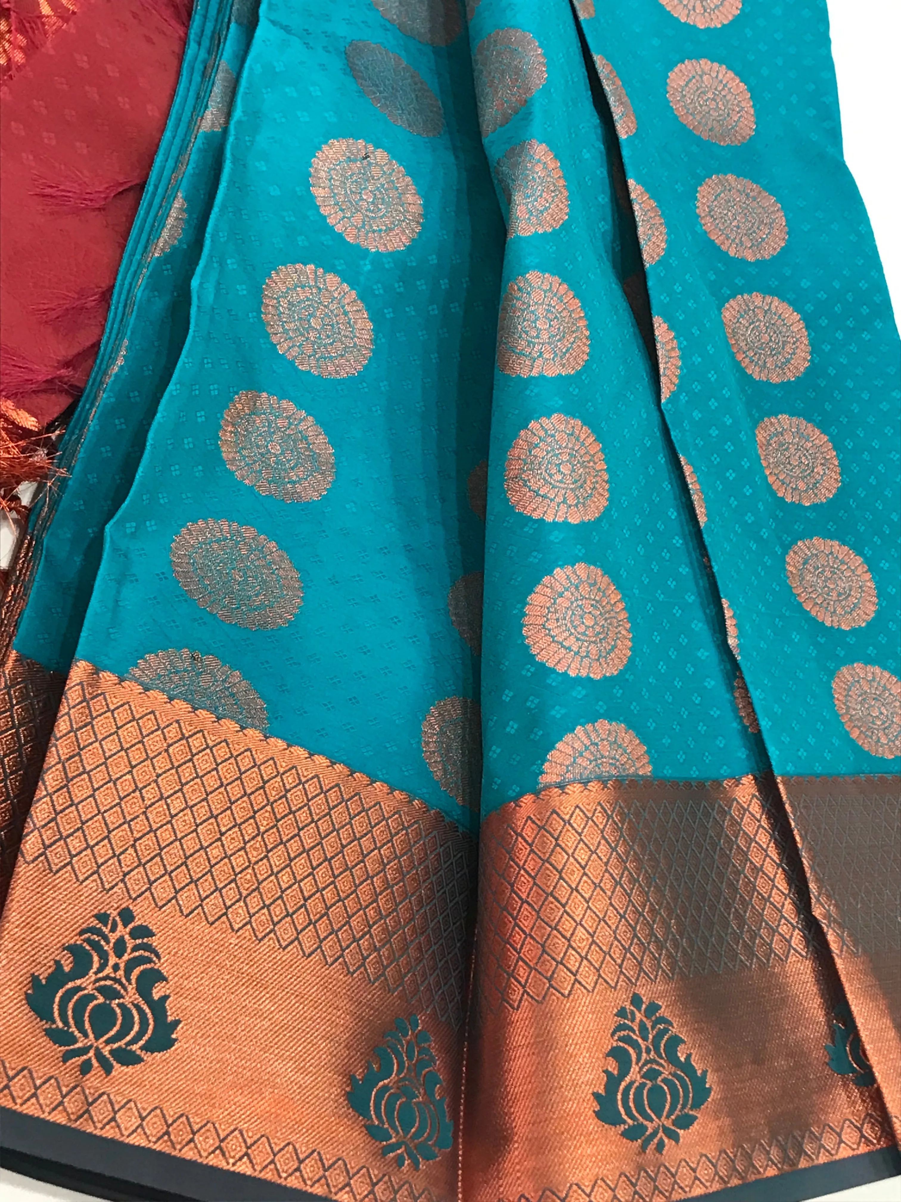 Beautiful Blue Color Emboss Butta Motifs All Over Body And Copper Zari Border