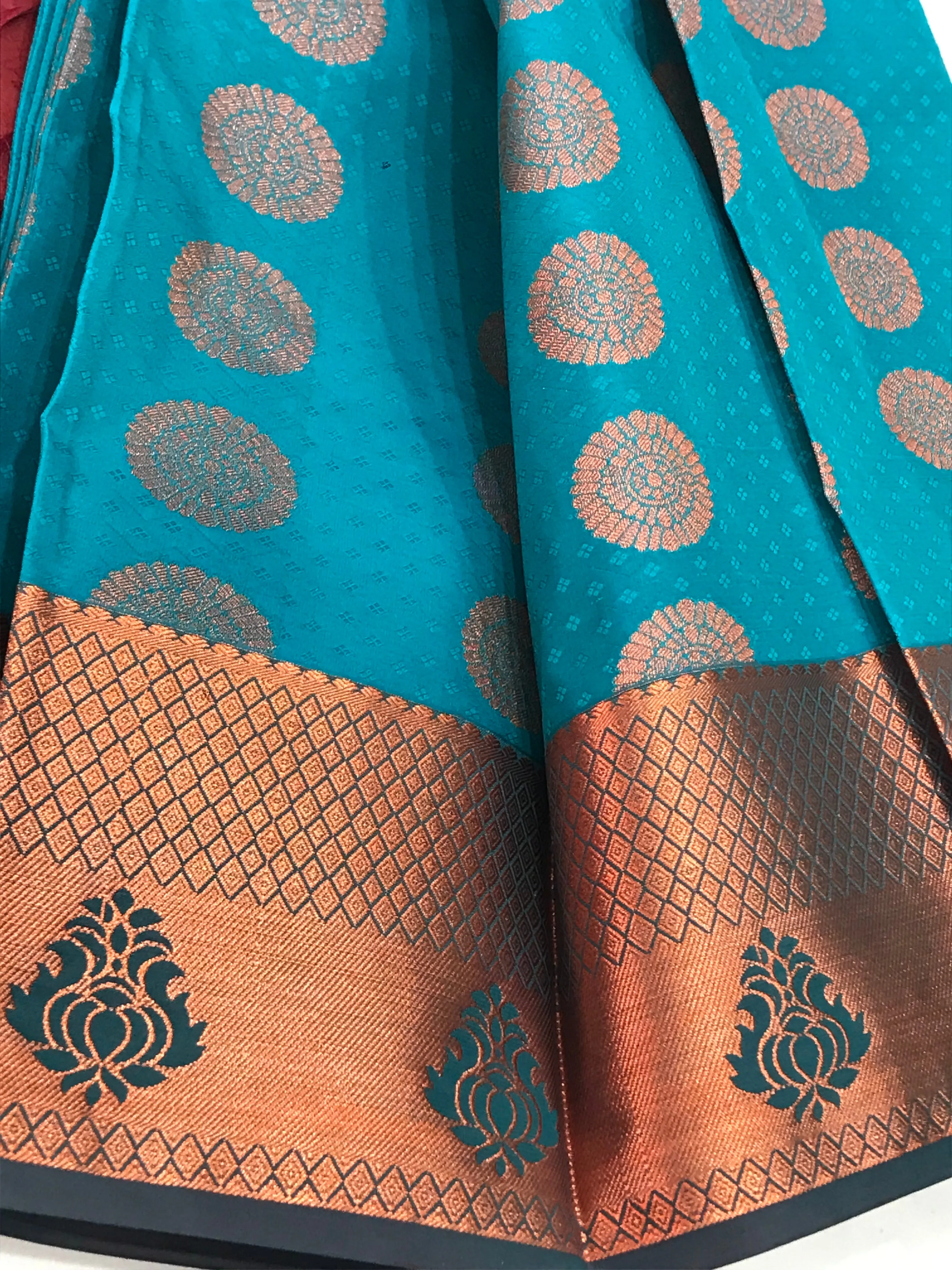 Beautiful Blue Color Emboss Butta Motifs All Over Body And Copper Zari Border