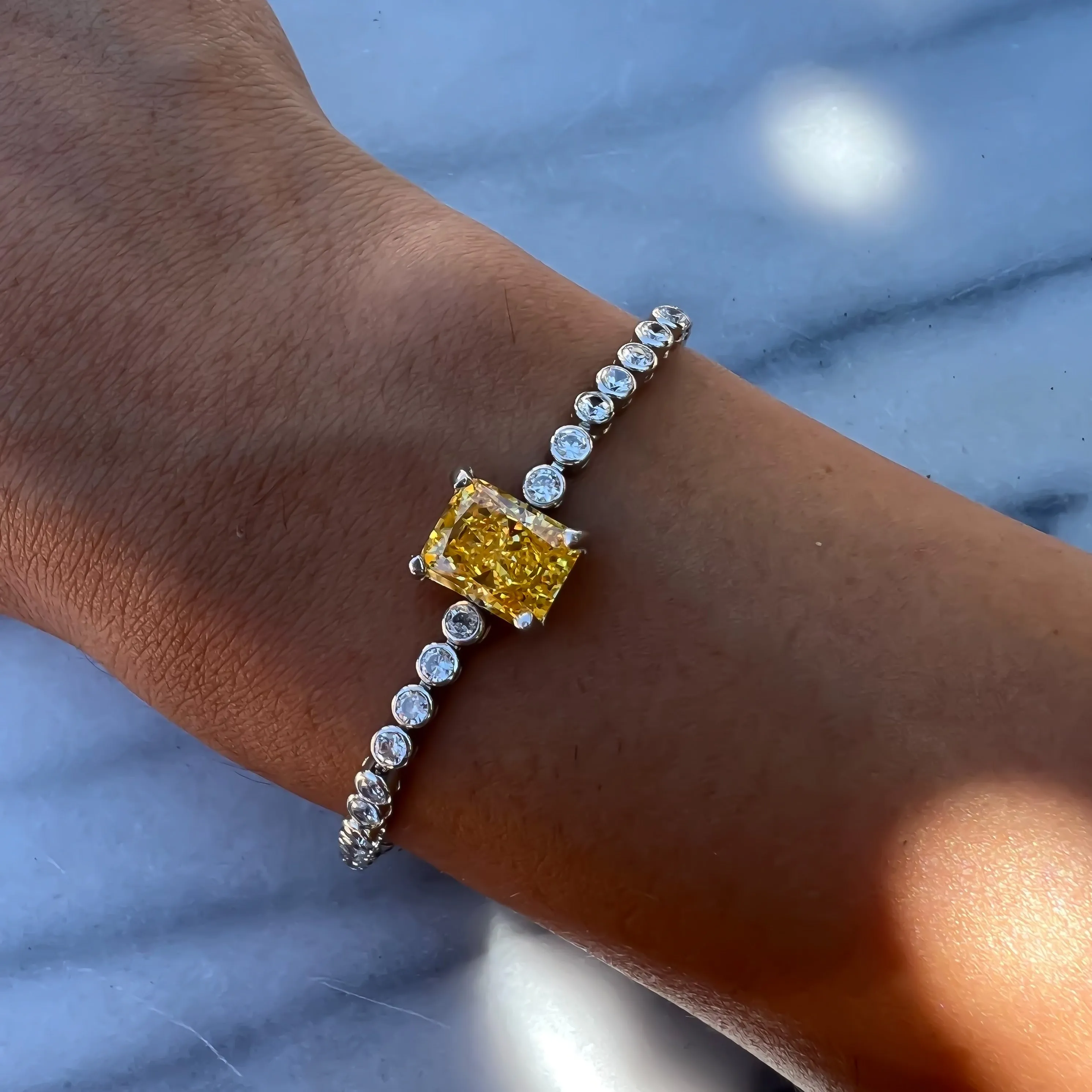 Yellow emerald cut sterling silver tennis bracelet