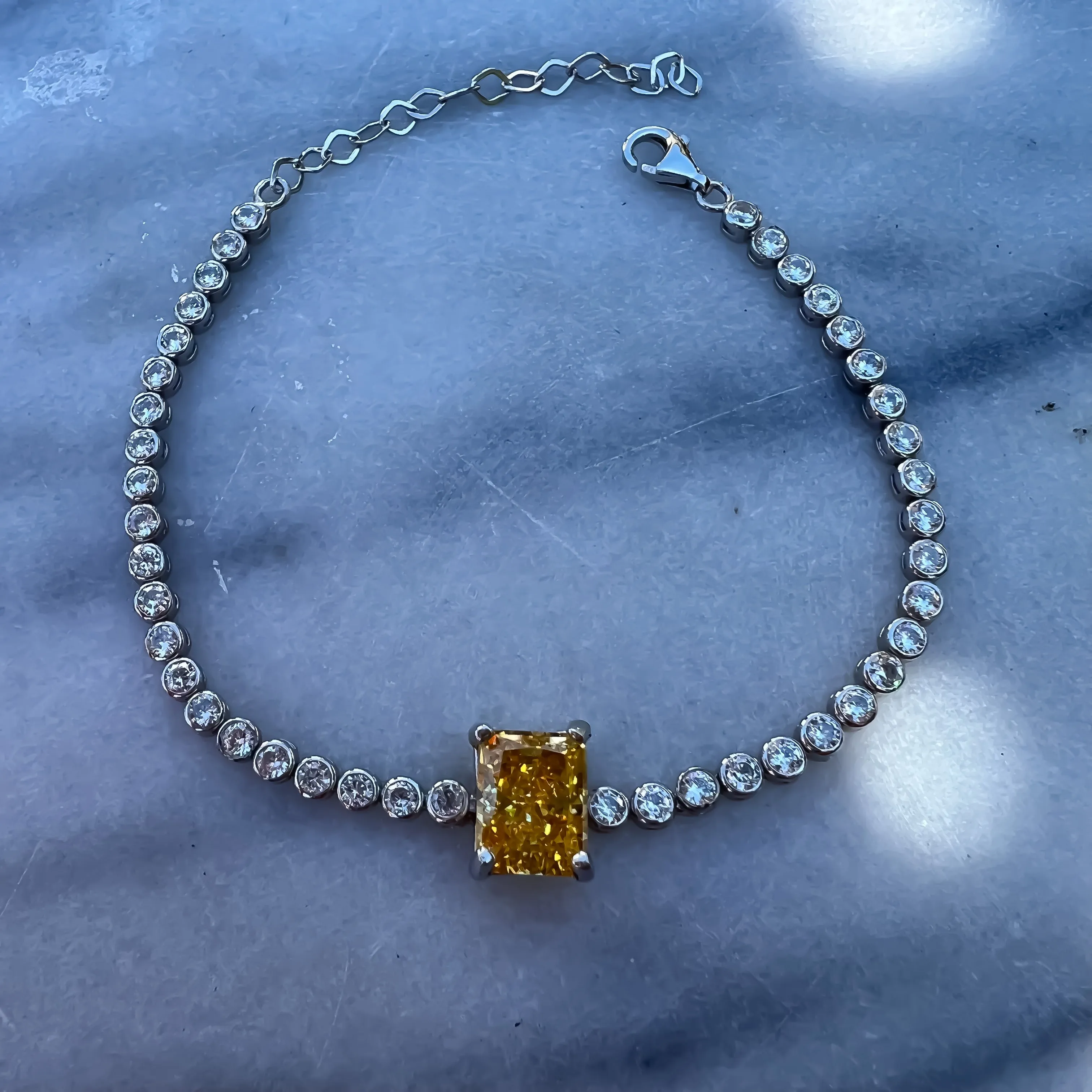 Yellow emerald cut sterling silver tennis bracelet